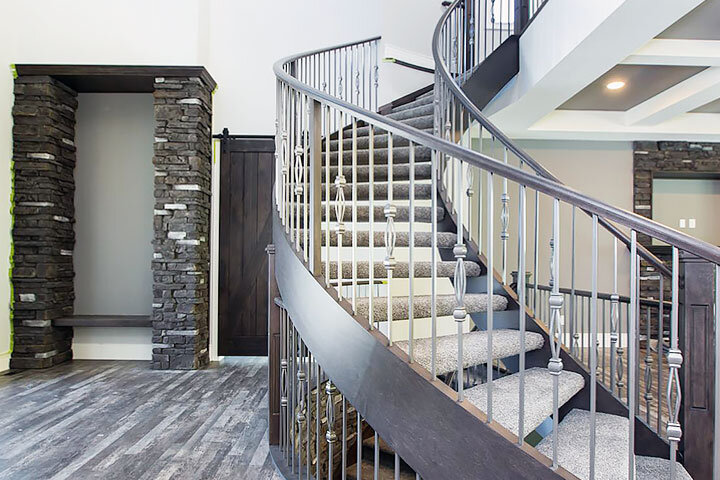 Curved Staircase Around Stone Feature Wall - Custom Staircases &amp; Railings