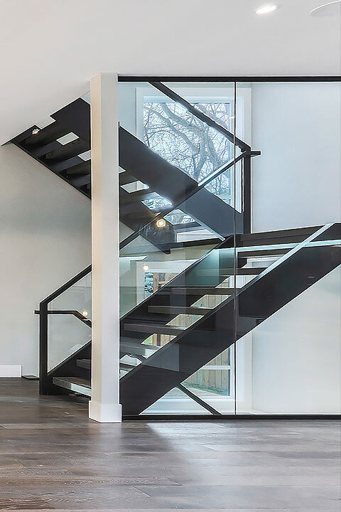 New Home with Glass Wall Staircase