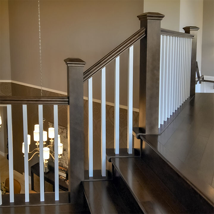 staircase with wood baluster railings